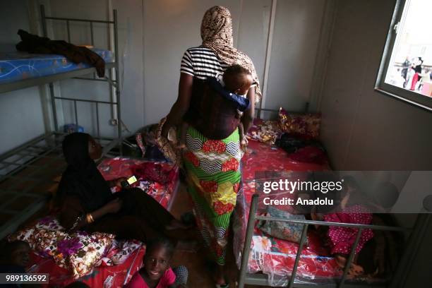 African migrants who will be repatriated to their countries by Algerian government, are seen at a temporary refuge center, near the border of Niger...