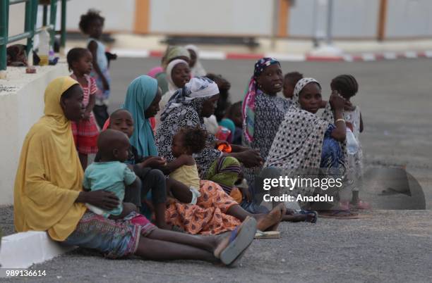 African migrants who will be repatriated to their countries by Algerian government, are seen at a temporary refuge center, near the border of Niger...