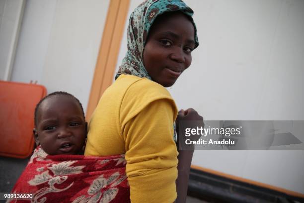 African migrants who will be repatriated to their countries by Algerian government, are seen at a temporary refuge center, near the border of Niger...
