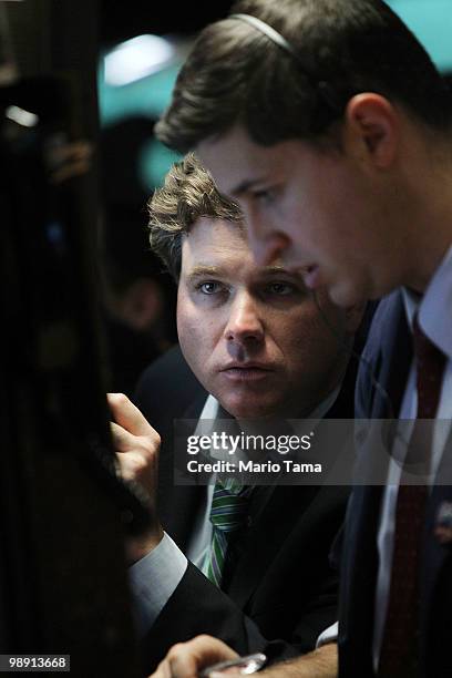 Traders work on the floor of the New York Stock Exchange before the closing bell May 7, 2010 in New York City. Stocks closed down nearly 140 points...