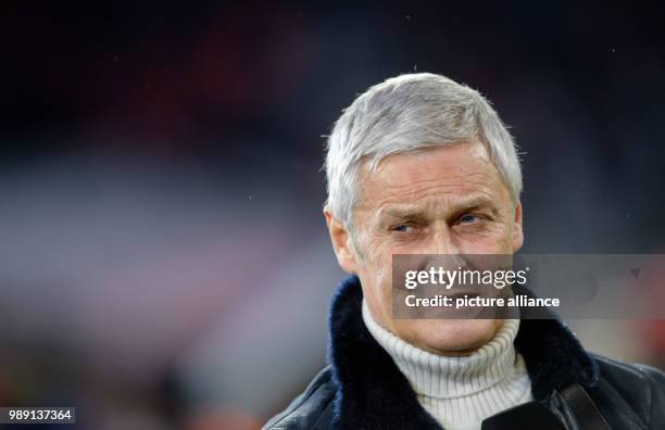 Cologne's sports director Armin Veh gives an internview prior to the German Bundesliga soccer match between Bayern Munich and 1. FC Cologne in the...