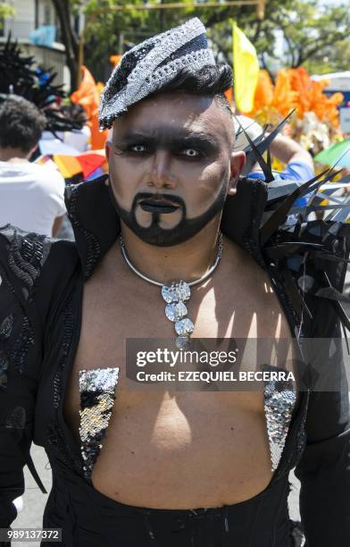 Reveler takes part in the Gay Pride Parade in San Jose on July 01, 2018.