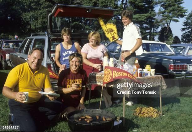 Family of Boston College QB Doug Flutie father Richard, mother Joan, brother Darren, sister Denise and brother Bill tailgating in parking lot before...