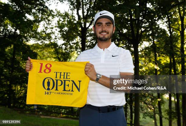 Abraham Ancer of Mexico holds an Open Championship hole flag after qualifying for the Open Championship during the fourth and final round of the...