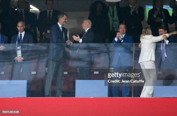 King Felipe VI of Spain salutes FIFA President Gianni Infantino while Prime Minister of Russia Dmitry Medvedev and his wife Svetlana Medvedeva...