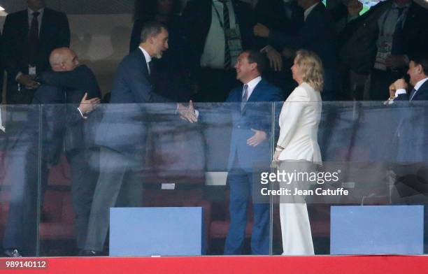 King Felipe VI of Spain congratulates Prime Minister of Russia Dmitry Medvedev and his wife Svetlana Medvedeva for the victory on a penalty shootout...