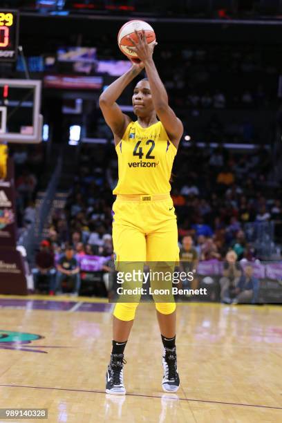 Jantel Lavender of the Los Angeles Sparks shoots three point basket against the Las Vegas Aces during a WNBA basketball game at Staples Center on...