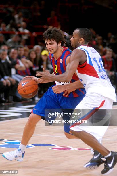 Ricky Rubio of Barcelona and John Robert Holden of CSKA in action during the Euroleague Basketball Semi Final 1 between Regal FC Barcelona and CSKA...