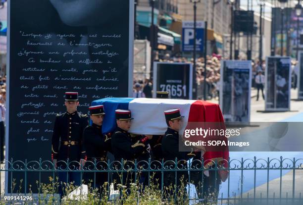 Soldiers are seen carrying caskets of Simone and Antoine Veil during the ceremony. Burial ceremony at the Pantheon of former French politician and...