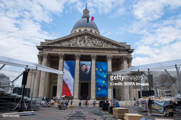 Portrait of Simone Veil hangs between two flags. The burial ceremony of former French politician and Holocaust survivor Simone Veil and her husband...