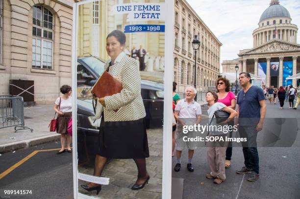 People looking at the displayed portrait of Simone Veil. The burial ceremony of former French politician and Holocaust survivor Simone Veil and her...