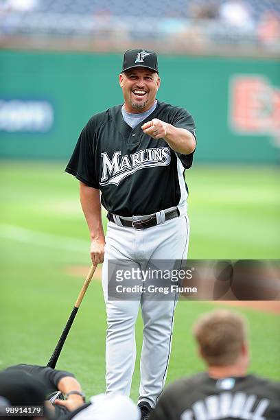 Manager Fredi Gonzalez of the Florida Marlins talks with players before the game against the Washington Nationals at Nationals Park on May 7, 2010 in...