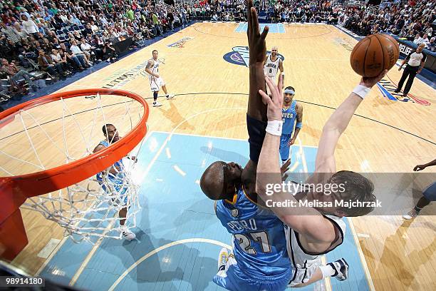 Kyrylo Fesenko of the Utah Jazz goes to the basket against Johan Petro of the Denver Nuggets in Game Six of the Western Conference Quarterfinals...