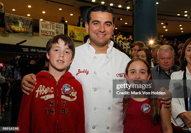 Matthew Laforest, Pastry Chef/ TV personality Buddy Valastro, and Madeline Lafores kick-off National Train Day festivities at NYC's Penn Station...