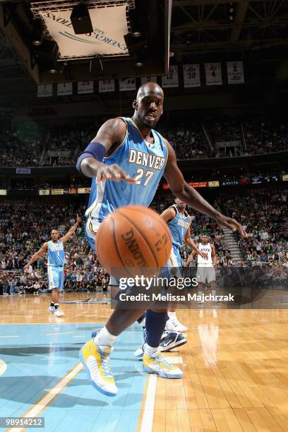 Johan Petro of the Denver Nuggets goes after a loose ball against the Utah Jazz in Game Six of the Western Conference Quarterfinals during the 2010...