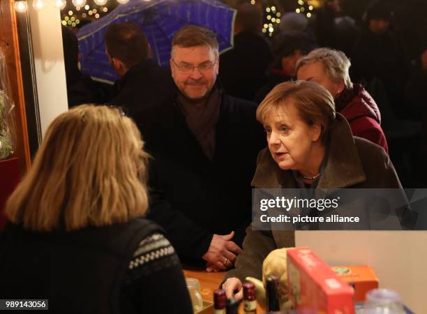 German chancellor Angela Merkel of the Christian Democratic Union party visits the Breitscheidplatz almost one year after the terrorist attack and...