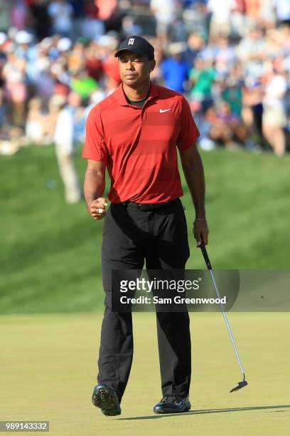 Tiger Woods reacts on the 18th green during the final round of the Quicken Loans National at TPC Potomac on July 1, 2018 in Potomac, Maryland.