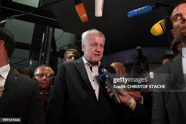 German Interior Minister and leader of the Christian Social Union Party Horst Seehofer speaks to journalists after a party leadership meeting at the...