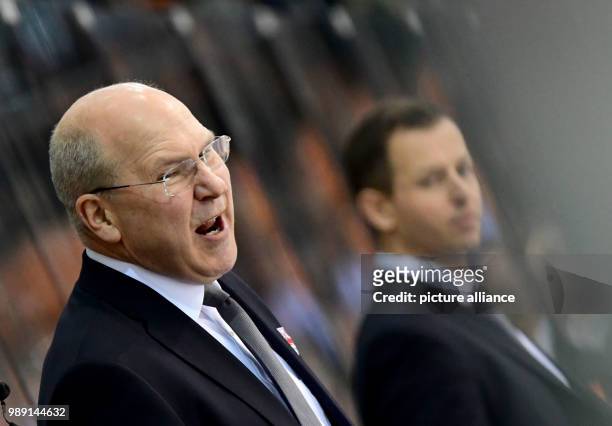 Munich coach Don Jackson watches the DEL ice hockey game between Grizzlys Wolfsburg and EHC Red Bull Munich at the Eis Arena Wolfsburg in Wolfsburg,...