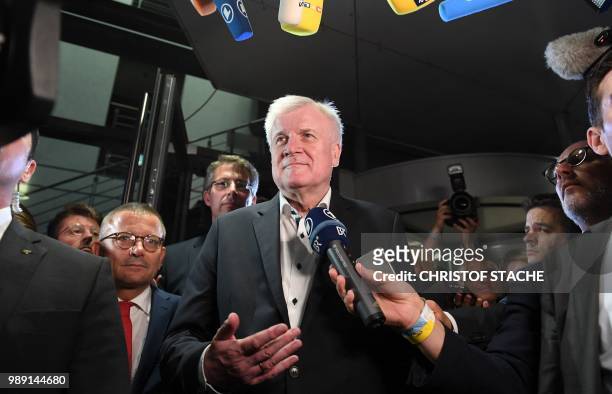 German Interior Minister and leader of the Christian Social Union Party Horst Seehofer speaks to journalists after a party leadership meeting at the...