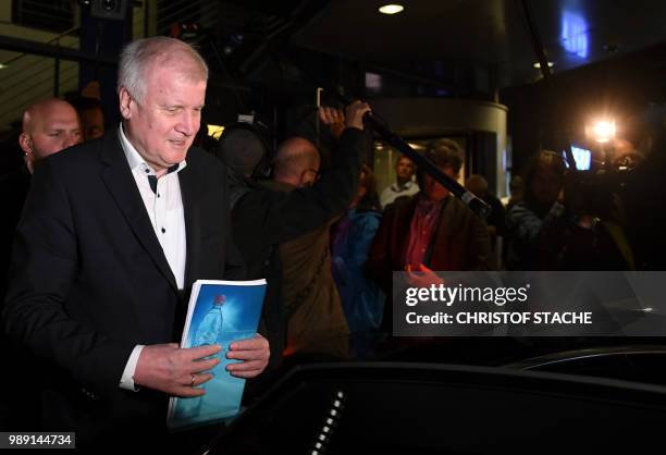 German Interior Minister and leader of the Christian Social Union Party Horst Seehofer leaves after a party leadership meeting at the CDU...