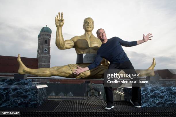 Actor Jean-Claude Van Damme poses during a press conference in Munich, 14 December 2017. Van Damme is going to play the lead character in Amazon's...