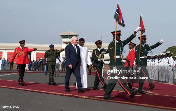 German President Frank-Walter Steinmeier is bidden farewell with military honours by the president of the Republic of The Gambia, Adama Barrow, at...