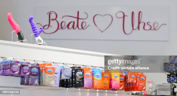 File picture dated 13 June 2014 shows various packs of Durex condoms, vibrators and dildos in a Beate Uhse AG sex shop in Hanover, Germany. Photo:...