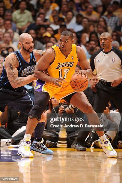 Andrew Bynum of the Los Angeles Lakers posts up against Carlos Boozer of the Utah Jazz in Game Two of the Western Conference Semifinals during the...