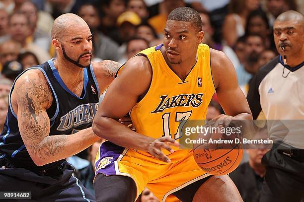 Andrew Bynum of the Los Angeles Lakers posts up against Carlos Boozer of the Utah Jazz in Game Two of the Western Conference Semifinals during the...