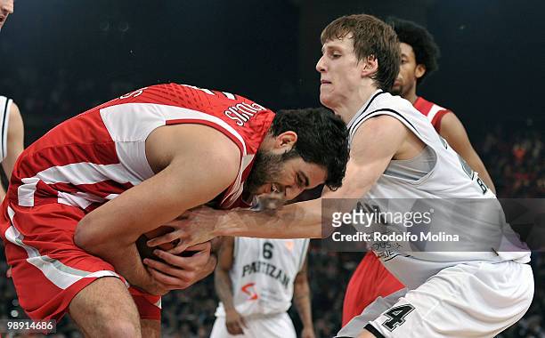 Ioannis Bourousis, #9 of Olympiacos Piraeus competes with Jan Vesely, #24 of Partizan Belgrade during the Euroleague Basketball Semifinal 2 between...