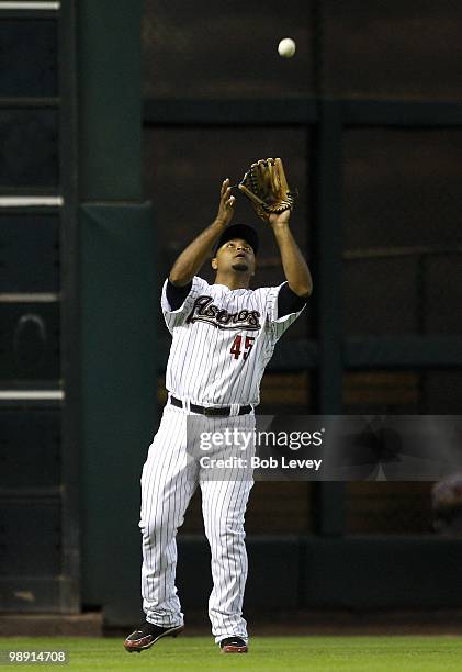 Left fielder Carlos Lee of the Houston Astros makes a catch on a fly ball against the Arizona Diamondbacks at Minute Maid Park on May 6, 2010 in...