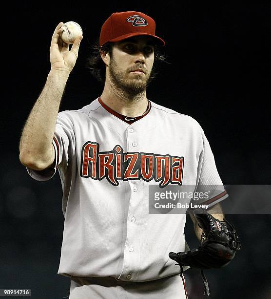 Pitcher Dan Haren of the Arizona Diamondbacks asks for another ball against the Houston Astros at Minute Maid Park on May 6, 2010 in Houston, Texas.