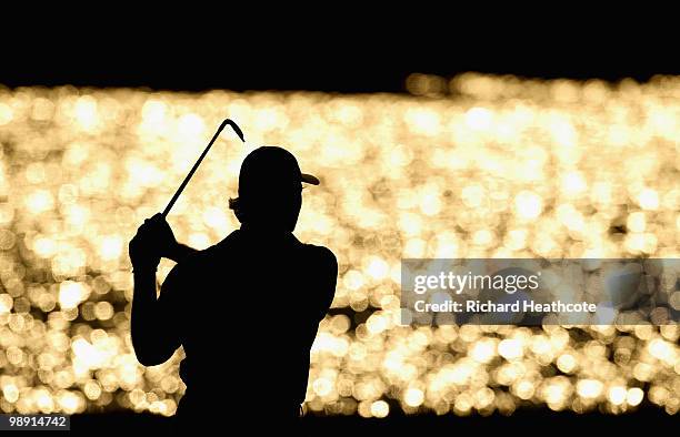 Ernie Els of South Africa watches his approach shot on the 18th hole during the second round of THE PLAYERS Championship held at THE PLAYERS Stadium...