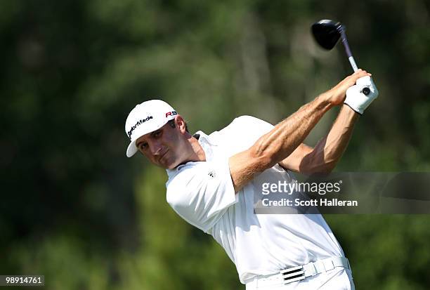 Dustin Johnson hits his tee shot on the 14th hole during the second round of THE PLAYERS Championship held at THE PLAYERS Stadium course at TPC...