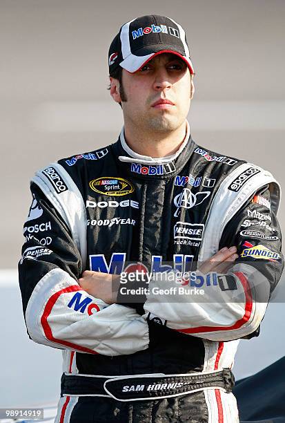 Sam Hornish Jr., driver of the Mobil 1 Dodge, stands on the grid during qualifying for the NASCAR Sprint Cup Series SHOWTIME Southern 500 at...