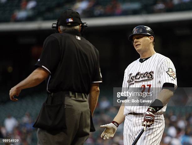 Geoff Blum of the Houston Astros questions home plate umpire Mike Winters about the strike call against the Arizona Diamondbacks at Minute Maid Park...