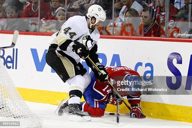 Brooks Orpik of the Pittsburgh Penguins and Tomas Plekanec of the Montreal Canadiens collide in Game Four of the Eastern Conference Semifinals during...
