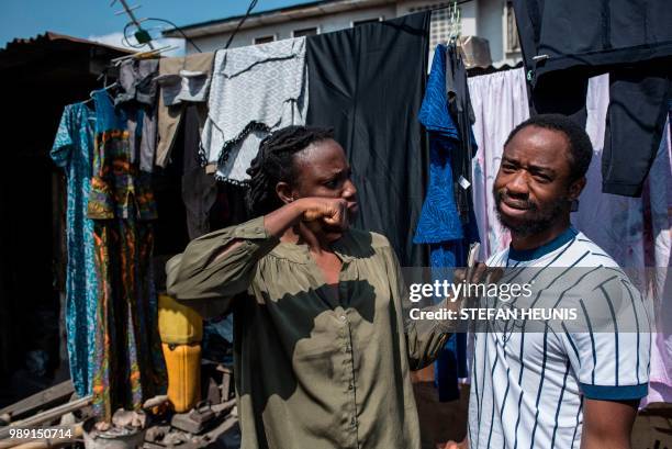 Nigerian film director of the Nollywood film "Kasala" Ema Edosio and Nigerian actor Abiodun Kassim, pose in the Oju Elegba neighbourhood where the...