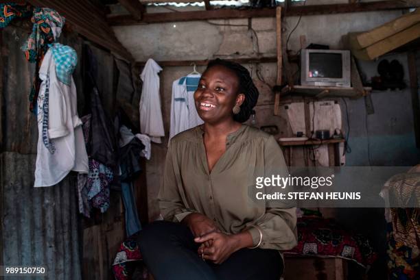 Nigerian film director of the Nollywood film "Kasala" Ema Edosio smiles during an interview on June 11, 2018 in Lagos. - Nigerian film director Ema...