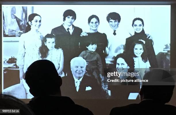 Picture of English actor, director, screenwriter and producer Charlie Chaplin, together with his family, being shown during a tour for the press in...