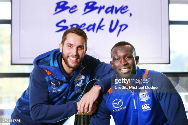 Jamie Macmillan and Majak Daw of the Kangaroos pose during a North Melbourne Kangaroos AFL media opportunity at Arden Street Ground on July 2, 2018...