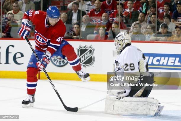 Andrei Kostitsyn of the Montreal Canadiens attempts to deflect the puck in front of Marc-Andre Fleury of the Pittsburgh Penguins in Game Four of the...