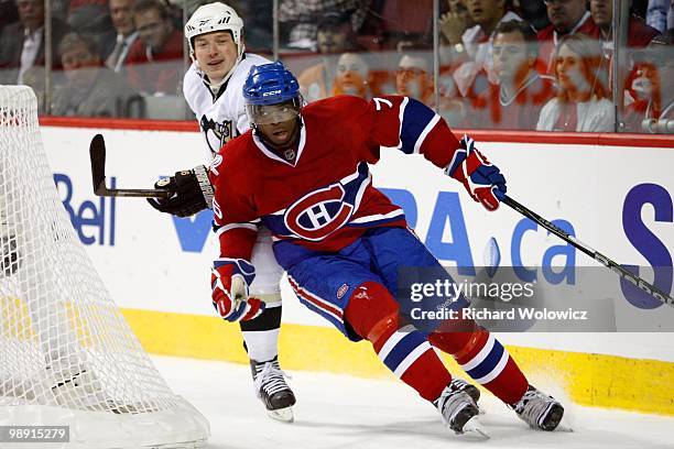 Subban of the Montreal Canadiens skates while being followed by Ruslan Fedotenko of the Pittsburgh Penguins in Game Four of the Eastern Conference...