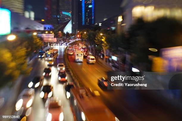 blurred city night traffic background, colorful light trace from night traffic at shanghai city,china - thruway stock-fotos und bilder