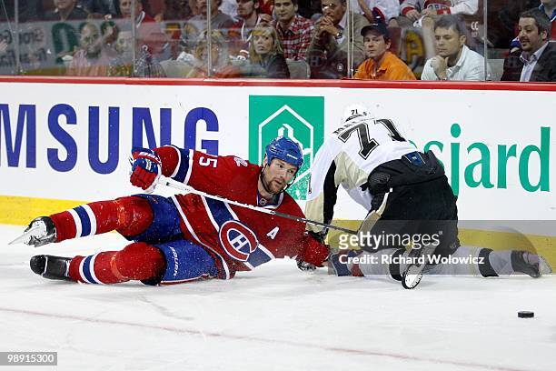 Hal Gill of the Montreal Canadiens and Evgeni Malkin of the Pittsburgh Penguins collide in Game Four of the Eastern Conference Semifinals during the...