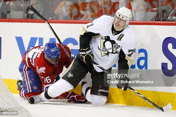 Evgeni Malkin of the Pittsburgh Penguins winces after colliding with P.K. Subban of the Montreal Canadiens in Game Four of the Eastern Conference...