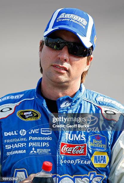 David Reutimann, driver of the Aaron's Dream Machine Toyota, stands on hte grid during qualifying for the NASCAR Sprint Cup Series SHOWTIME Southern...