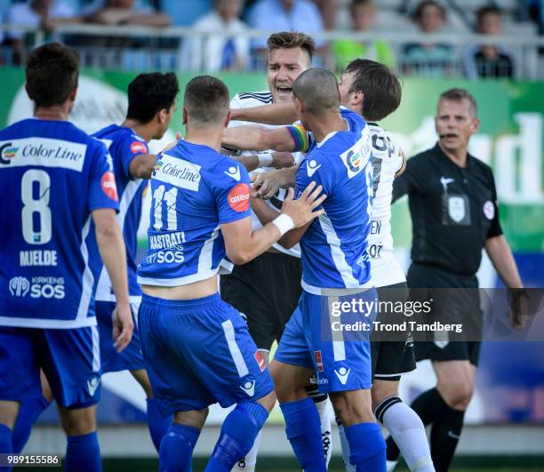 Nicklas Bendtner, Mike Jensen of Rosenborg, Referee Trygve kjensli during Sandefjord v Rosenborg at Komplett Arena on July 1, 2018 in Sandefjord,...