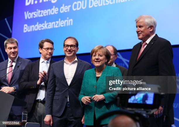 German chancellor, and CDU Chairwoman Angela Merkel arrives at the CSU's party congress with Bavarian Minister of Finance Markus Soder, CSU Secretary...